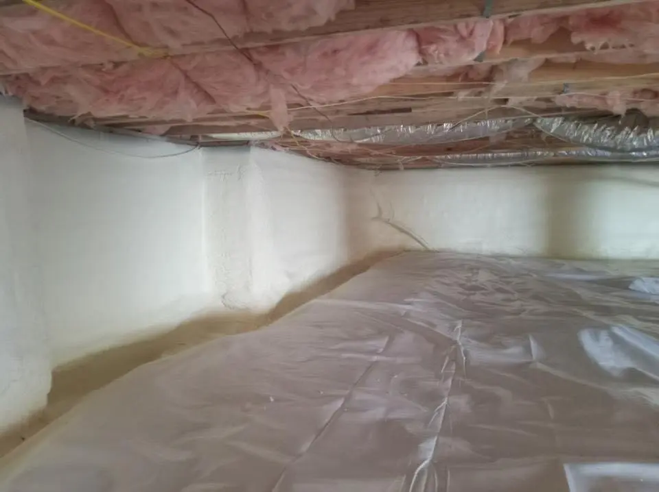 Crawl space encapsulation with closed-cell spray foam for Commercial Roof Restoration in Scott